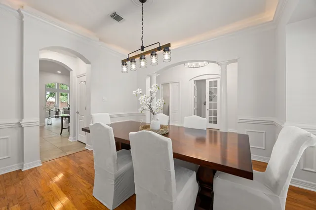 a living room with furniture and a bookshelf