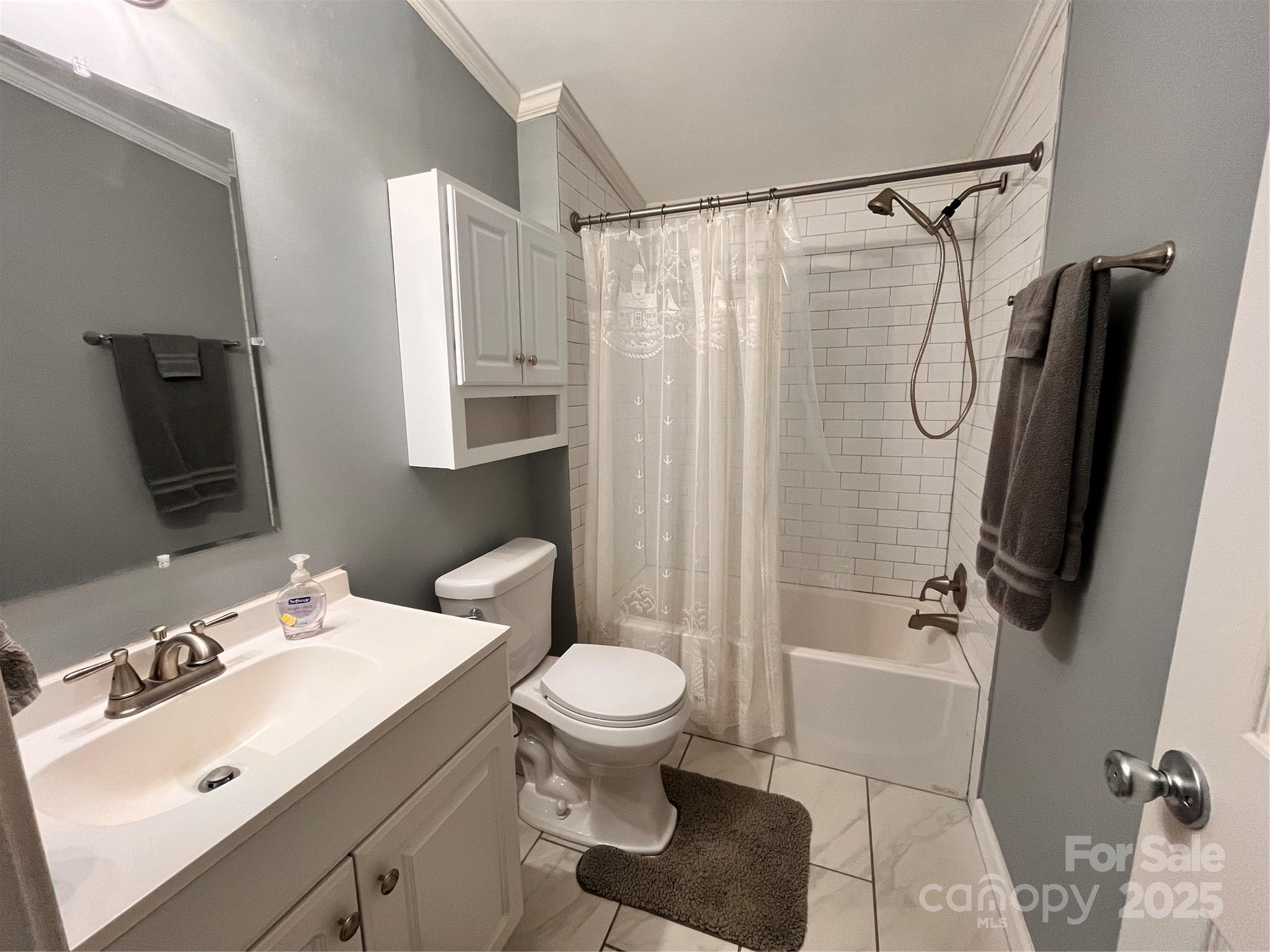 203 Shane Drive Mount Holly, NC 28120 - Photo 17 of 28 a bathroom with a sink toilet and shower