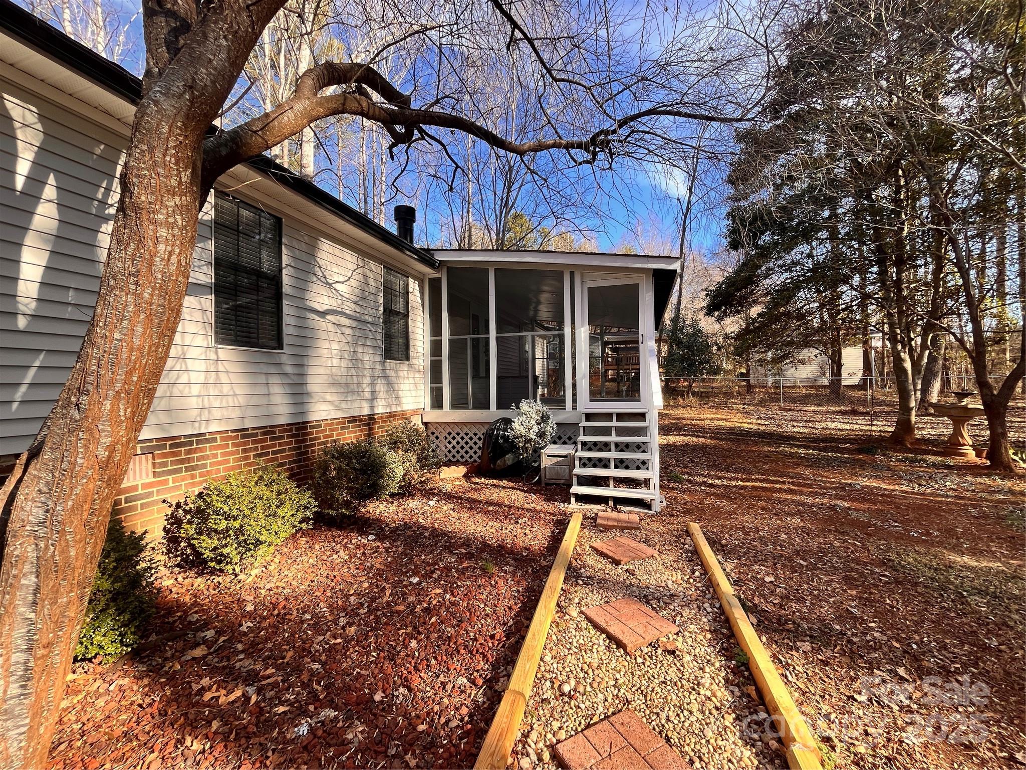 203 Shane Drive Mount Holly, NC 28120 - Photo 22 of 28 a view of a house with brick walls