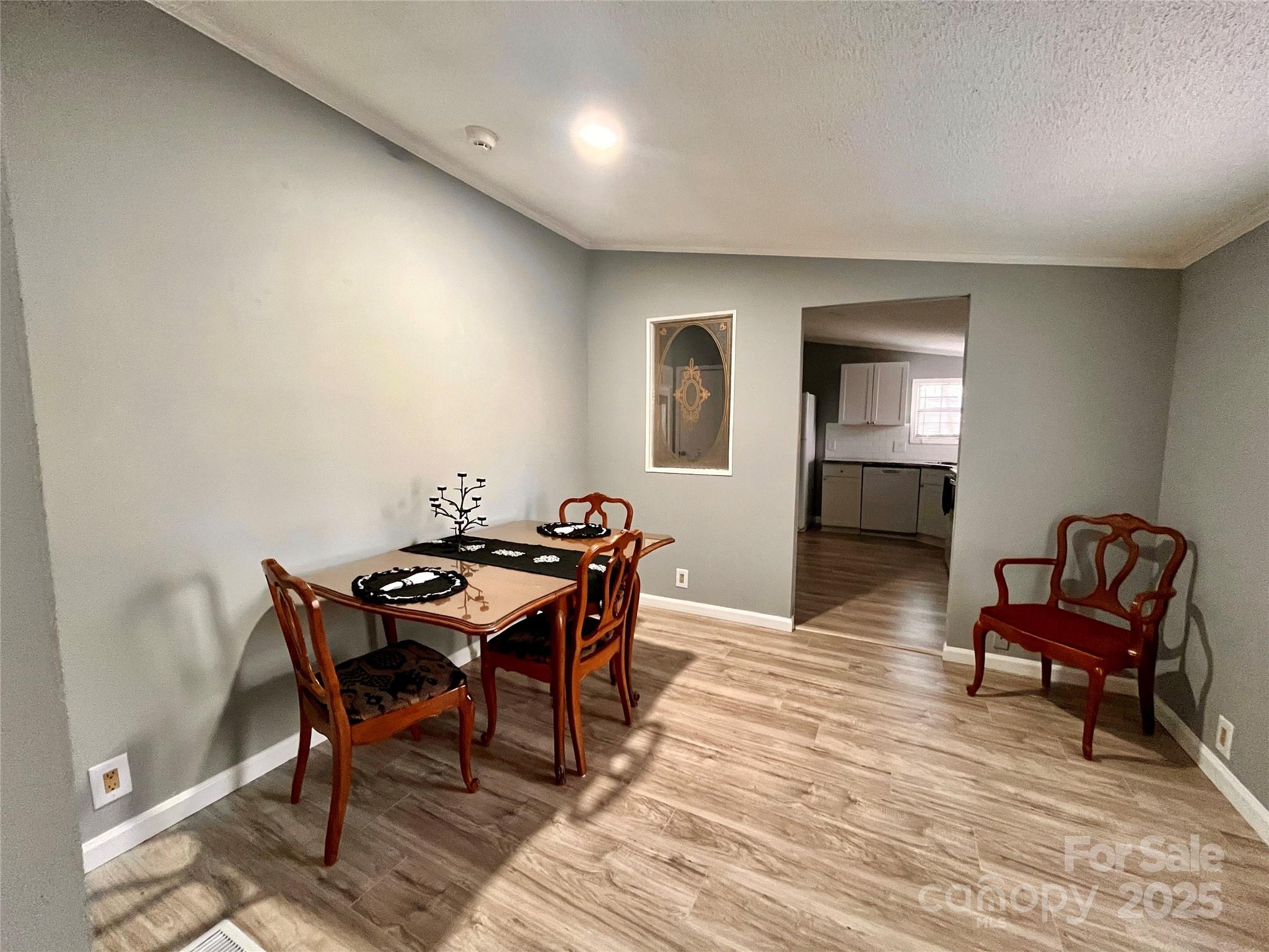 203 Shane Drive Mount Holly, NC 28120 - Photo 9 of 28 a view of a livingroom with furniture and a dining table