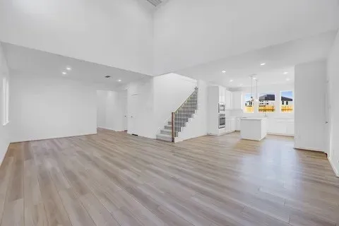 a view of a kitchen with a sink and a floor to ceiling window