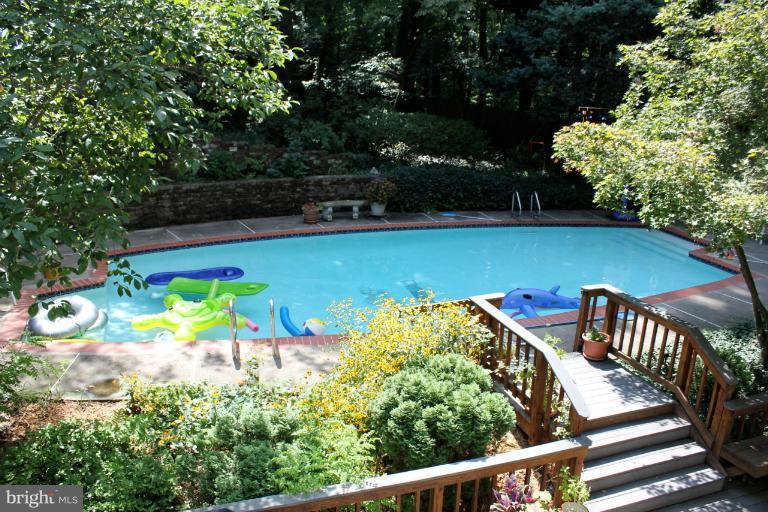 1954 Valley Wood Road McLean, VA 22101 - Photo 3 of 14 a view of a swimming pool with a patio