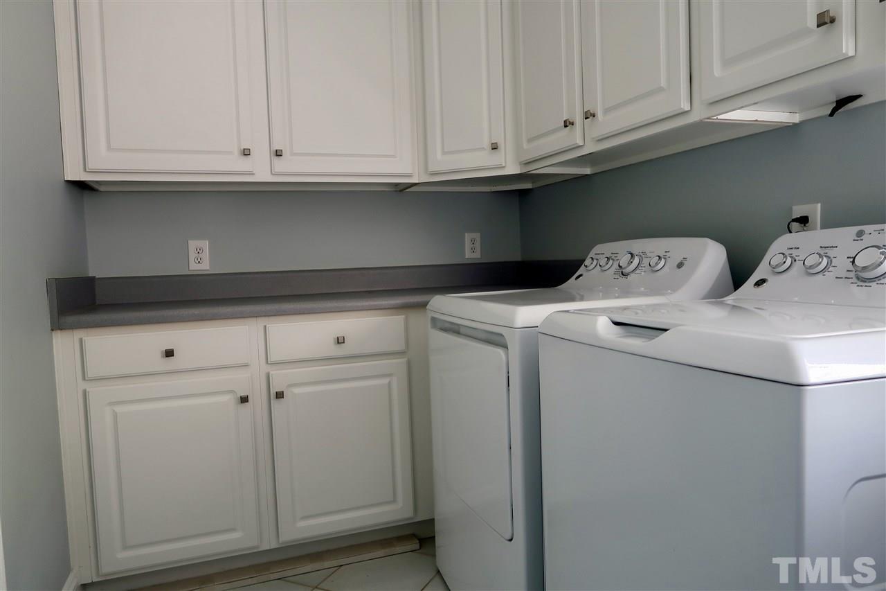 2815 Van Dyke Avenue Raleigh, NC 27607 - Photo 13 of 30 This laundry room has space and storage galore! There is also a utility sink on the other side of the room.