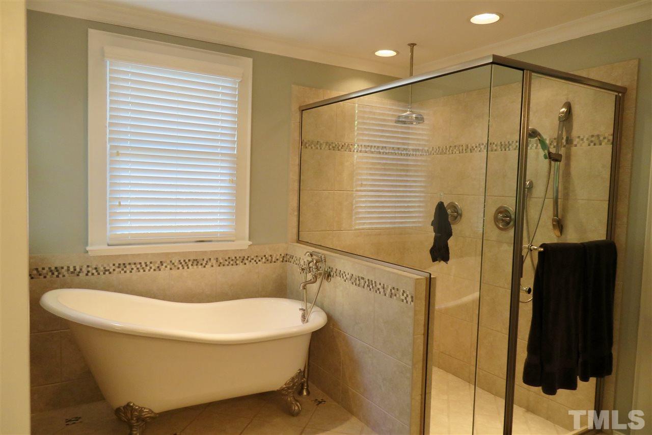 2815 Van Dyke Avenue Raleigh, NC 27607 - Photo 20 of 30 This claw foot tub, rain shower and double vanity with plenty of storage make this the ultimate en suite master bath!