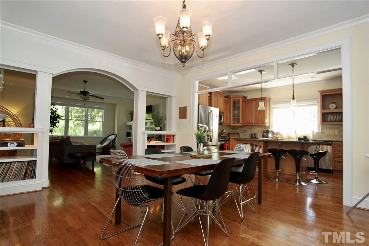 2815 Van Dyke Avenue Raleigh, NC 27607 - Photo 7 of 30 Room for more than a few guests. This open Dinning area is surrounded by simple detail with beautiful transom windows, archways and double sided built ins.
