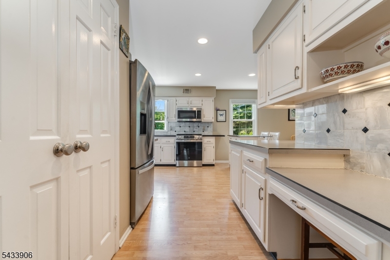 14 Lexington Road Annandale, NJ 08801 - Photo 10 of 47 a large kitchen with a large counter top appliances and cabinets