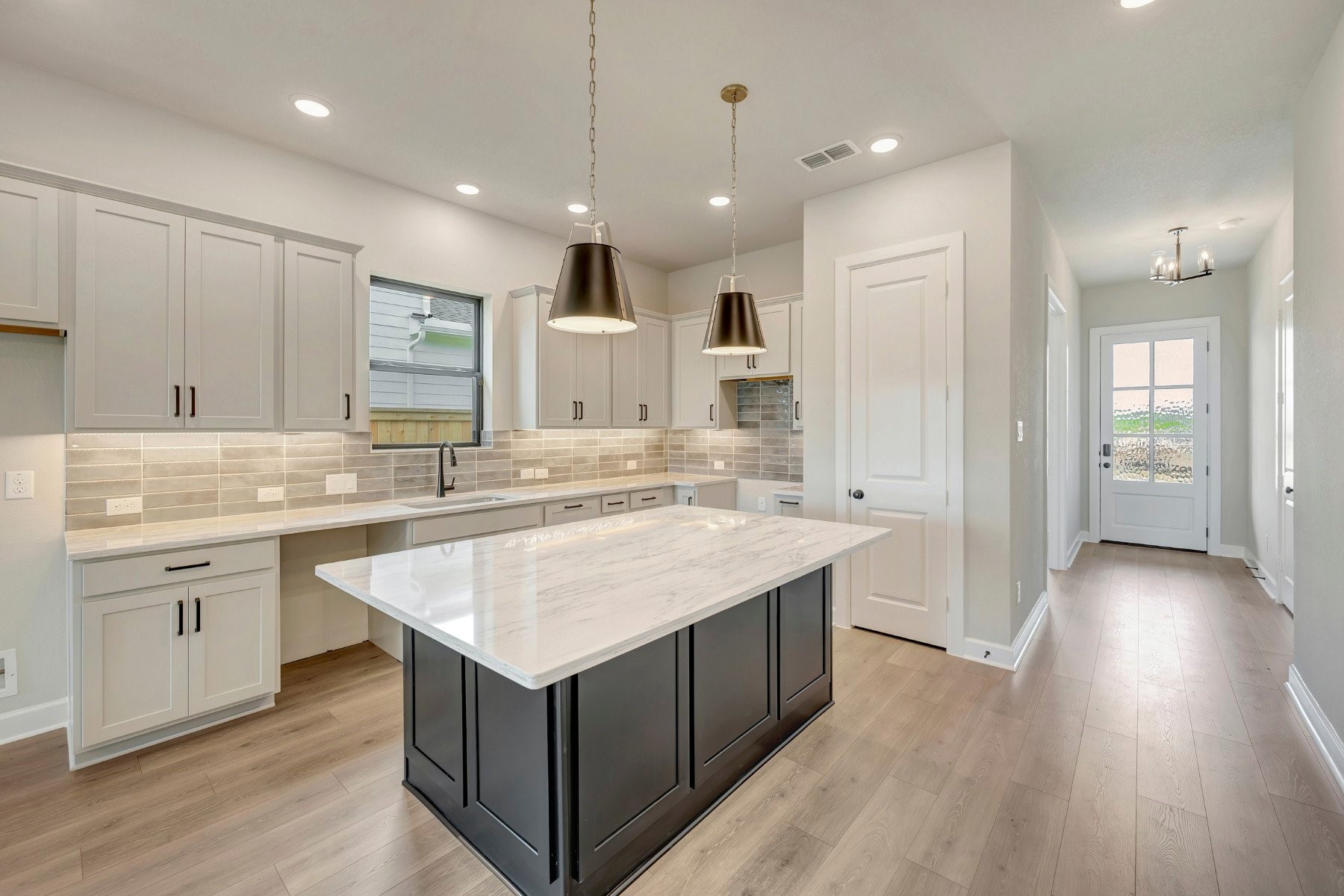 2722 Cottage Place Rosharon, TX 77583 - Photo 24 of 50 a kitchen with a sink stove and cabinets