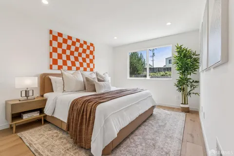 a bedroom with a bed and a view of bathroom