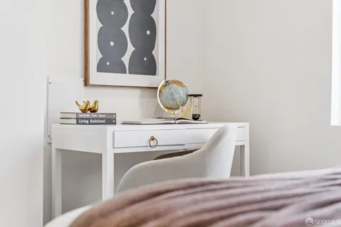 a bedroom with a bed and a lamp