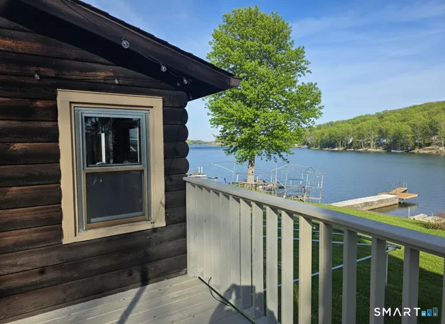 a view of a balcony with wooden floor and outdoor space