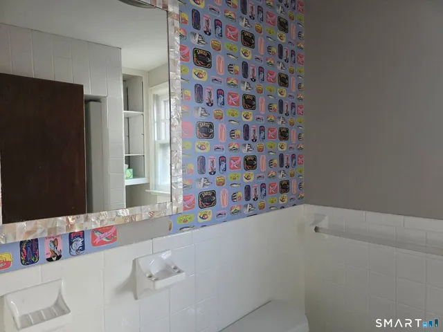 a view of hallway with wooden floor