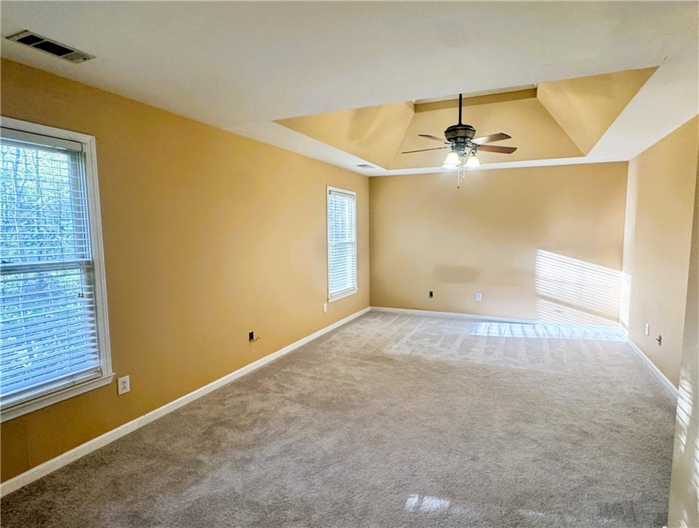 2550 Wellsley Lane Cumming, GA 30041 - Photo 13 of 19 an empty room with windows and ceiling fan