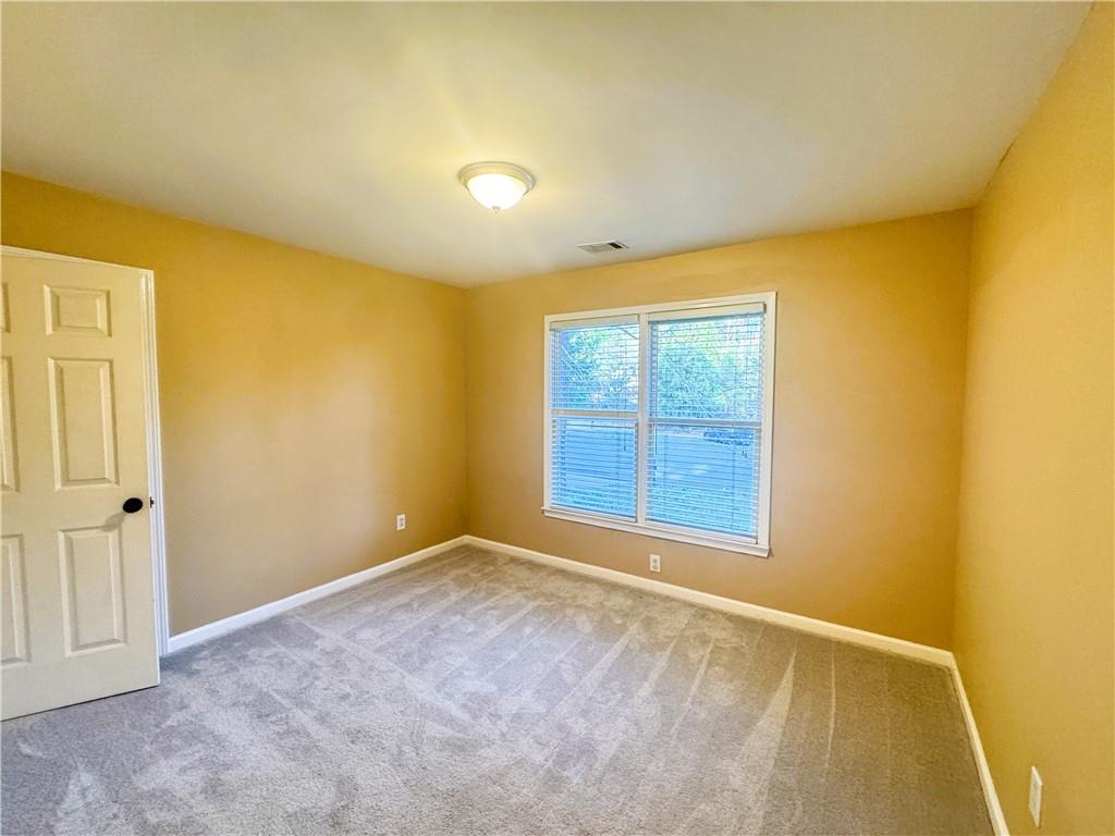 2550 Wellsley Lane Cumming, GA 30041 - Photo 14 of 19 an empty room with windows