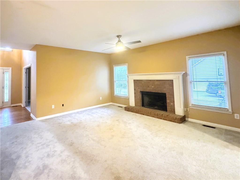 2550 Wellsley Lane Cumming, GA 30041 - Photo 5 of 19 a view of an empty room with a fireplace