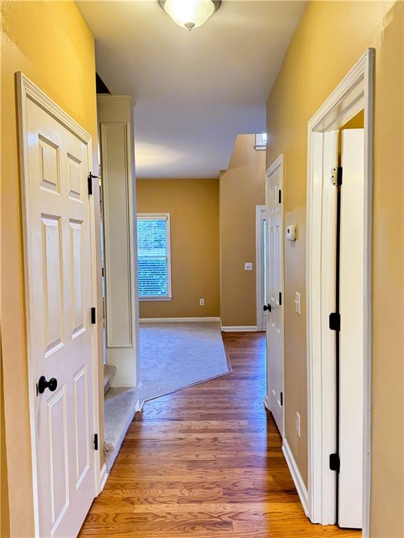 2550 Wellsley Lane Cumming, GA 30041 - Photo 9 of 19 a view of a hallway with wooden floor