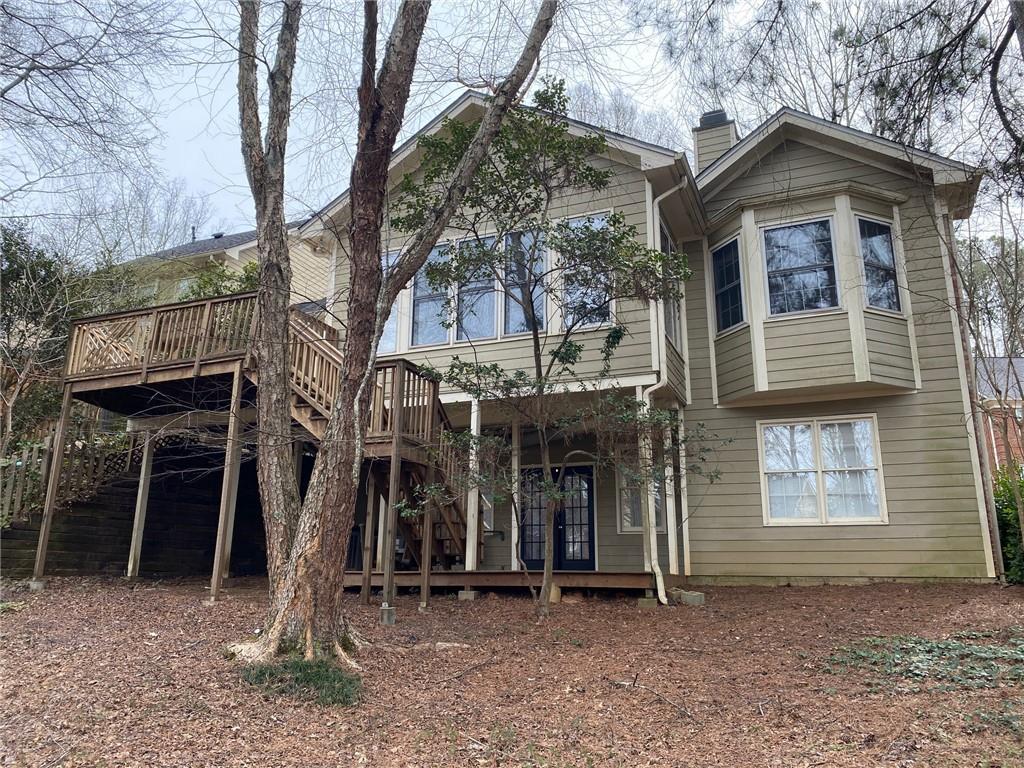 7155 Roswell Road, Unit 42 Sandy Springs, GA 30328 - Photo 34 of 34 a front view of a house with a yard