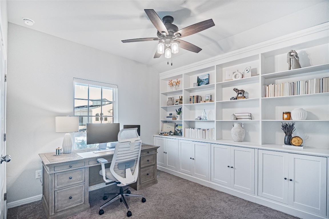 9905 Comely Bend Manor, TX 78653 - Photo 5 of 22 Office area featuring light carpet and ceiling fan