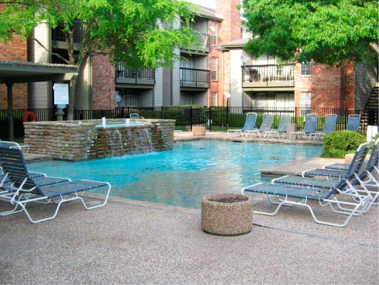 a view of a patio with table and chairs and potted plants