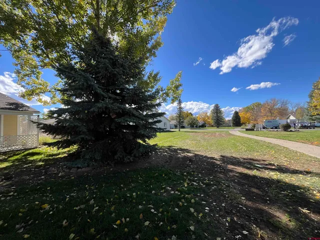 a view of a house with a big yard