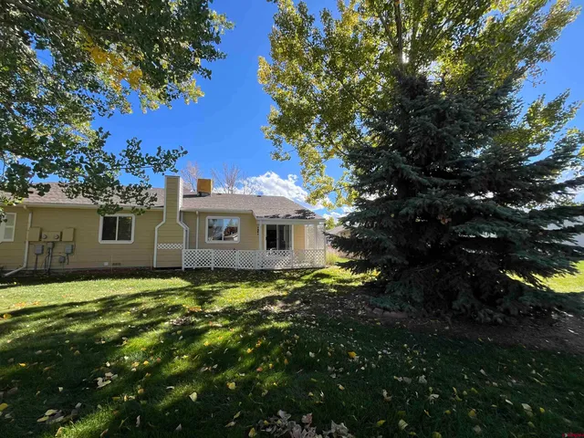 a view of a house with a big yard
