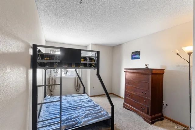 a view of a livingroom with furniture wooden floor and window