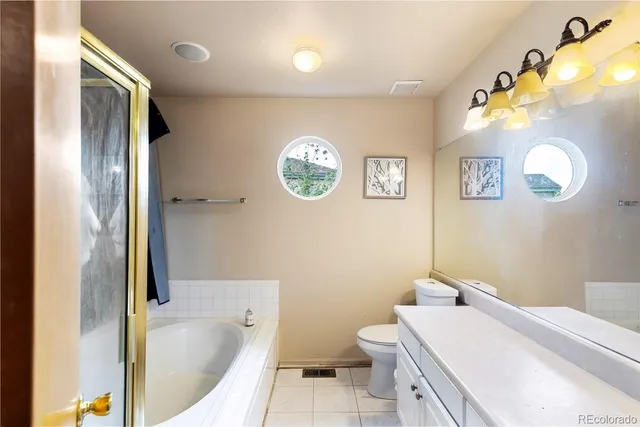 a bathroom with a sink a toilet and a bathtub