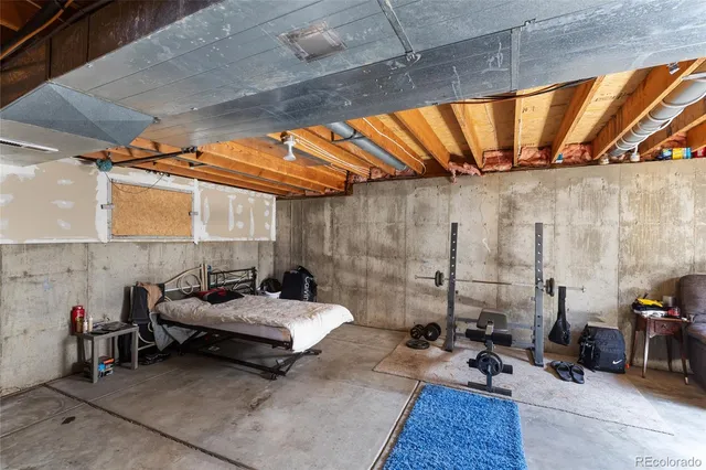 a view of a patio with a table and chairs
