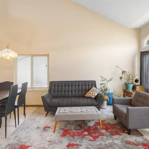 a living room with furniture and a couch