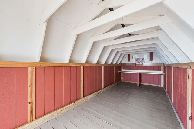 a bed room with bed and a large window