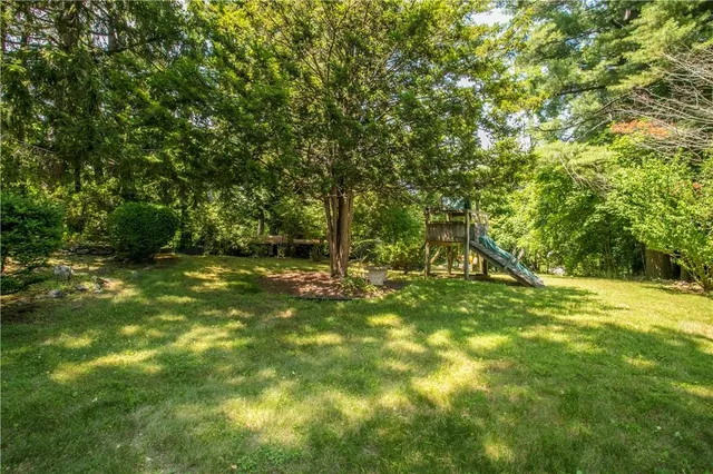 a view of outdoor space with deck and yard