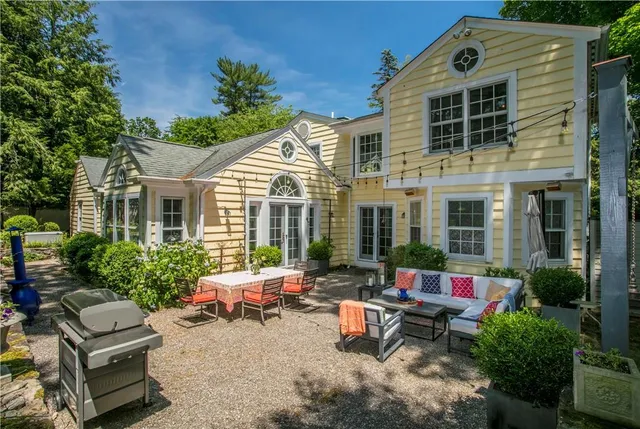a backyard of a house with seating space