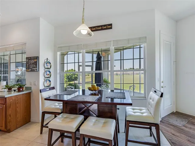 a work room with furniture and a large window