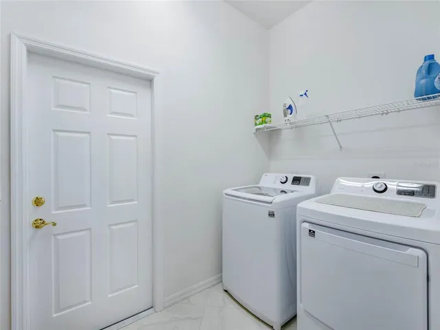 a view of storage room with washer and dryer