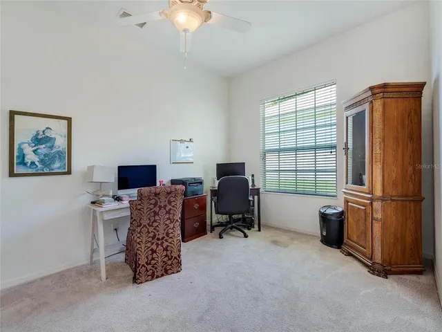 a workspace with furniture and a window