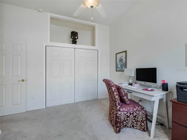 a workspace with furniture and window