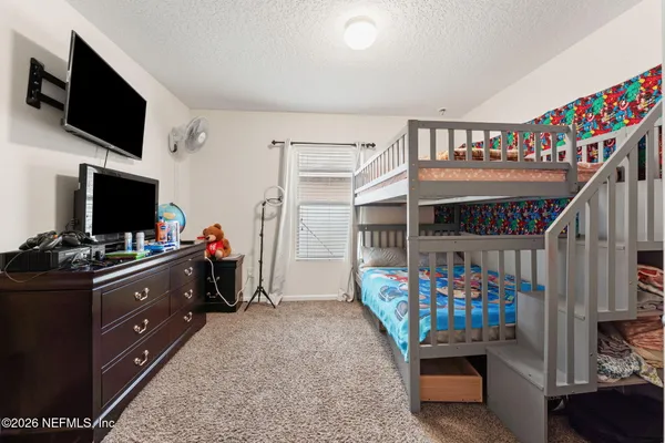 a room with furniture and a flat screen tv