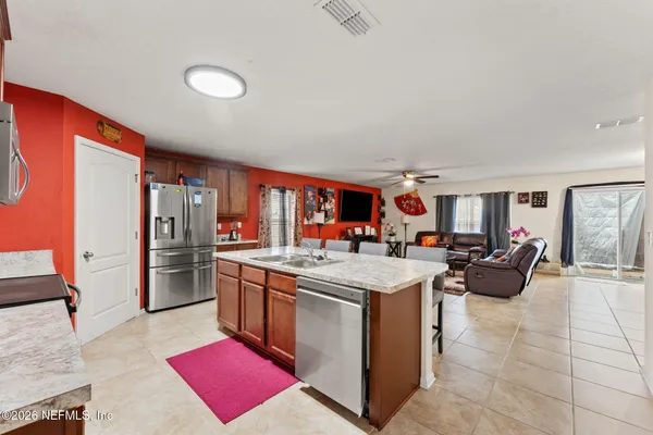 a view of living room with granite countertop furniture and rug