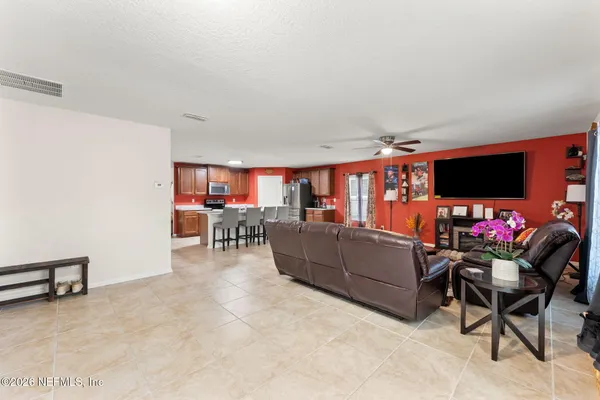 a living room with furniture and a flat screen tv