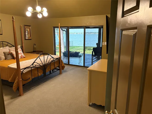 a bedroom with bed and window