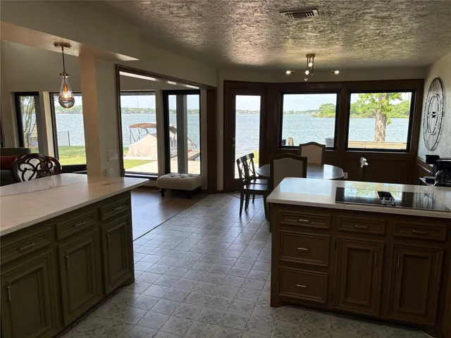 a large bathroom with a large window and a sink