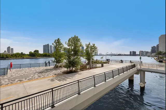 a view of a patio with couches table and chairs and potted plants