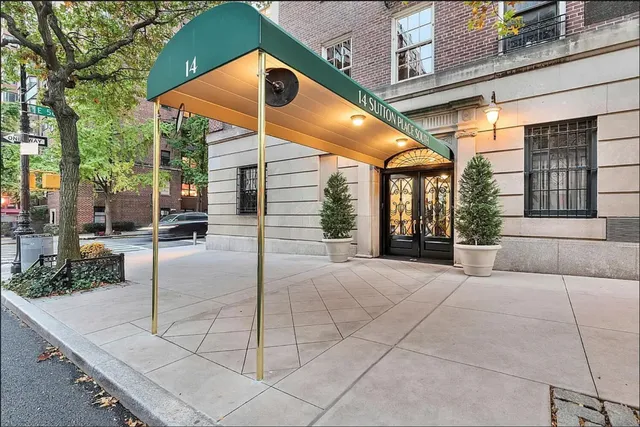 a view of a building with sitting area