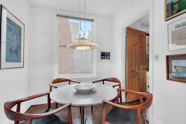 a living room with furniture a rug and a fireplace