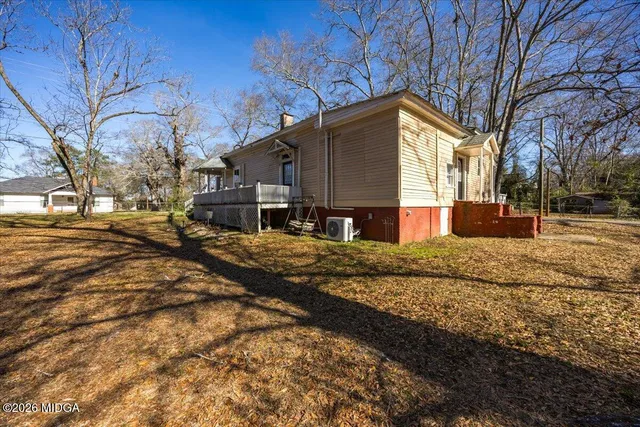 a view of road with large trees