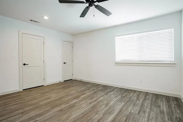 a kitchen with a refrigerator a sink and dishwasher a refrigerator with wooden floor