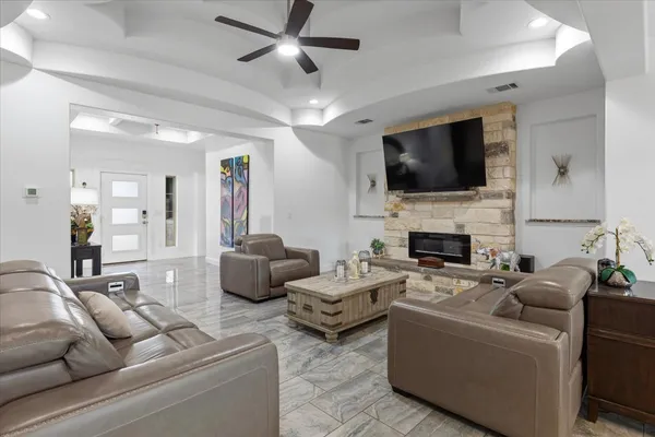 a kitchen with stainless steel appliances granite countertop a sink a stove and cabinets