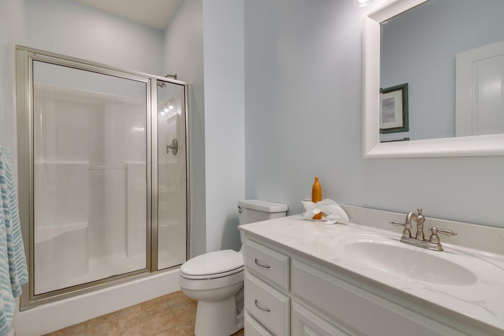 1002 Hallcrest Road Burns, TN 37029 - Photo 22 of 30 a bathroom with a sink toilet and shower