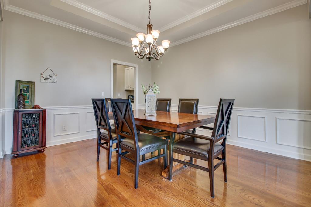 1002 Hallcrest Road Burns, TN 37029 - Photo 6 of 30 a view of a dining room with furniture and wooden floor