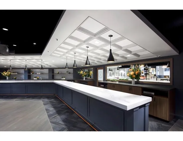 a kitchen with a sink and wooden cabinets