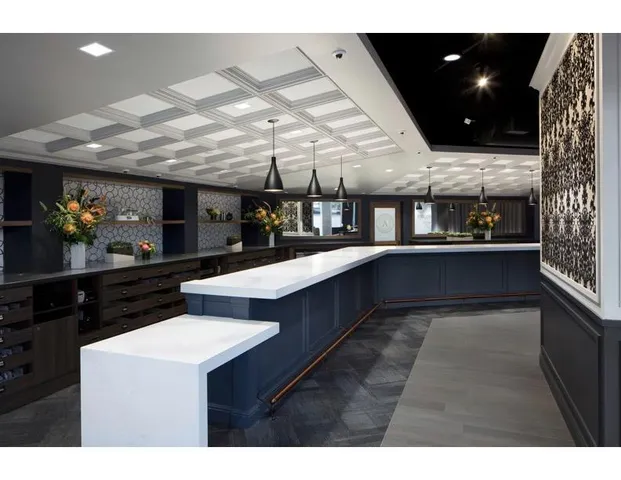 a view of a room with lots of counter space and furniture